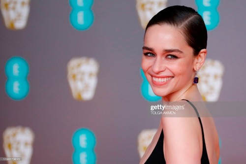 British actress Emilia Clarke poses on the red carpet upon arrival at the BAFTA British Academy Film