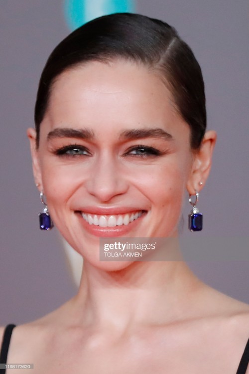 British actress Emilia Clarke poses on the red carpet upon arrival at the BAFTA British Academy Film