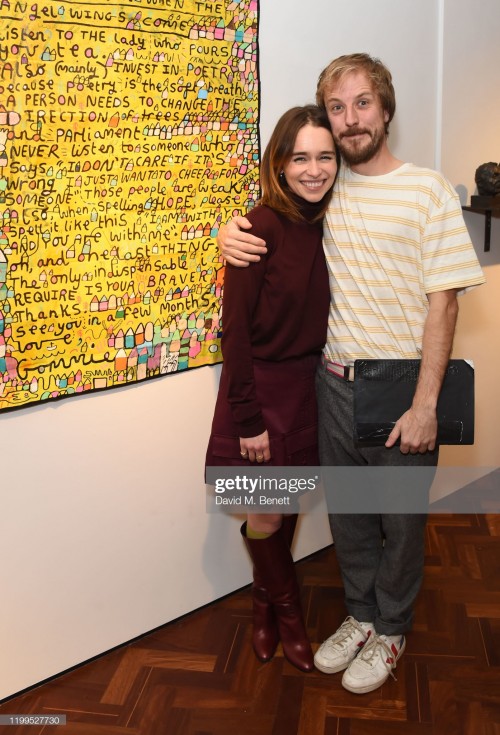 LONDON, ENGLAND - FEBRUARY 08:  Emilia Clarke and Ollie Gommie attend the Gommie exhibition at Messu